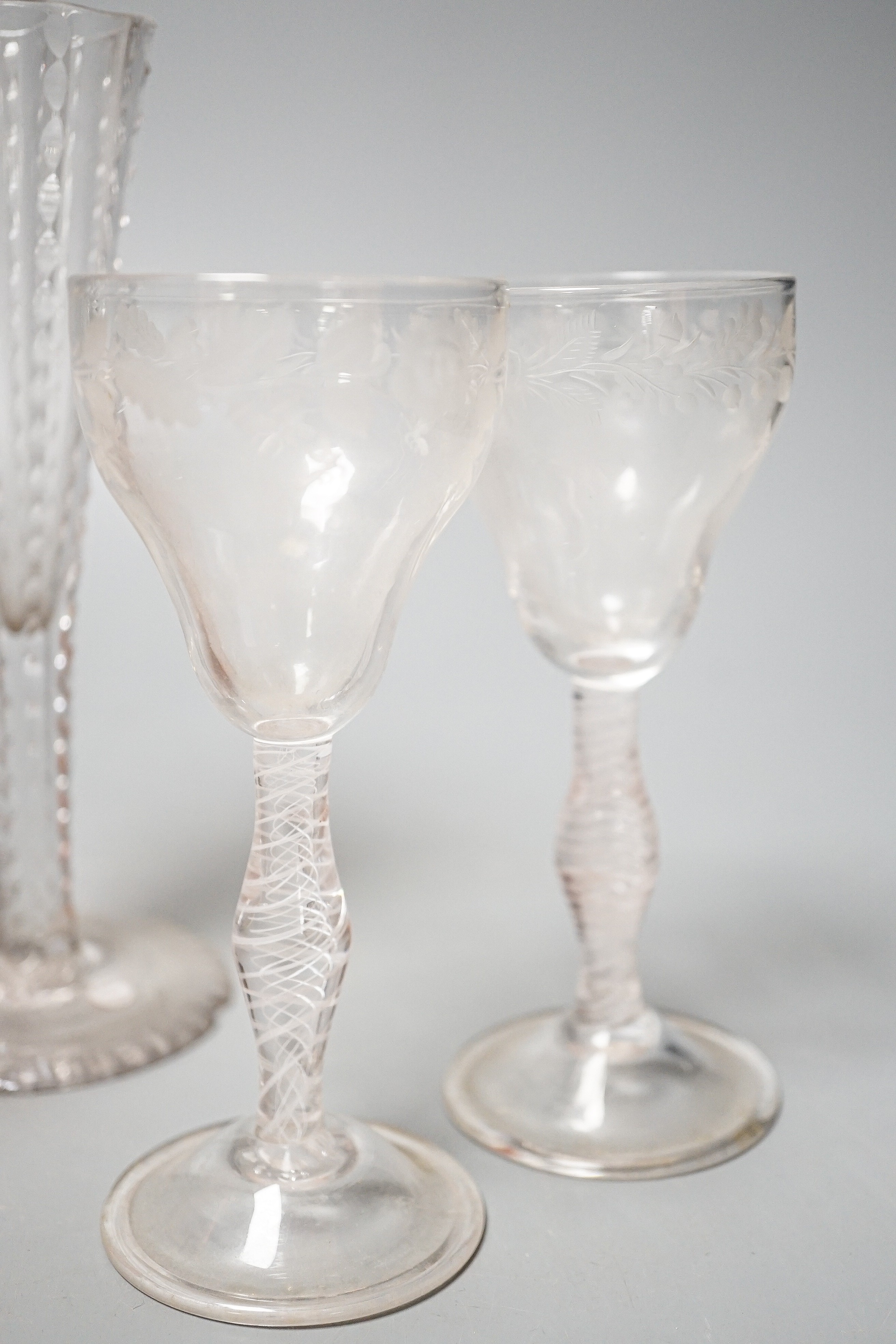 A pair of opaque twist cordial glasses with floral engraved bowls, 14cm and sundry glassware